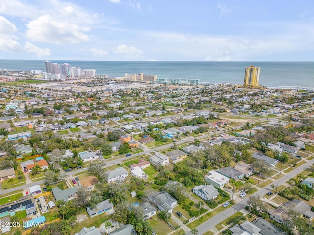 birds eye view of property featuring a view of city and a water view