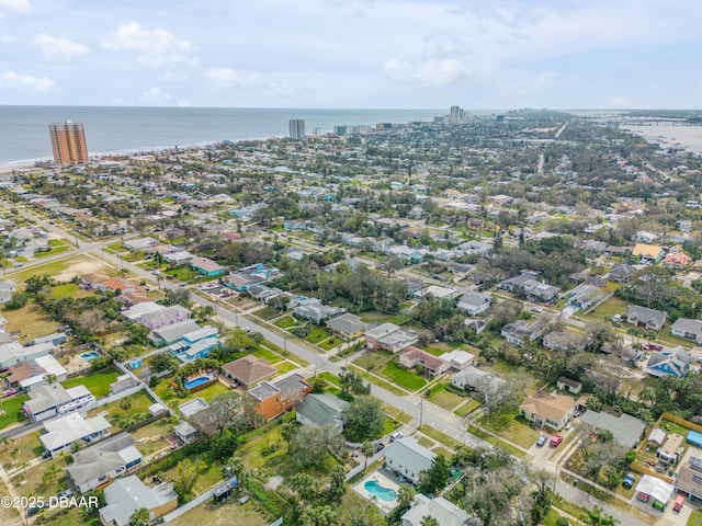 birds eye view of property with a water view and a residential view