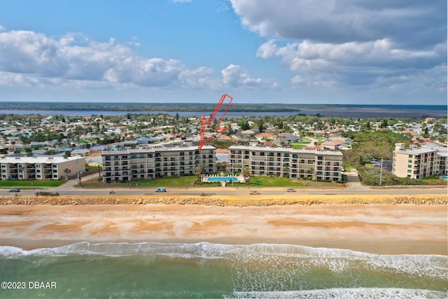 bird's eye view featuring a water view and a view of the beach