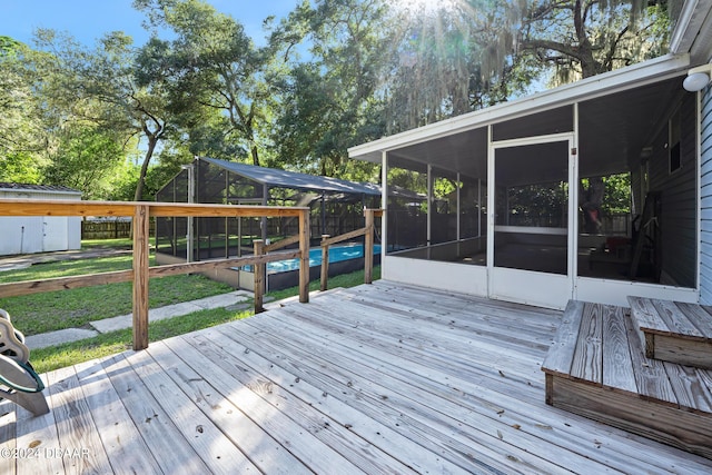 wooden deck featuring a yard, a lanai, and a sunroom