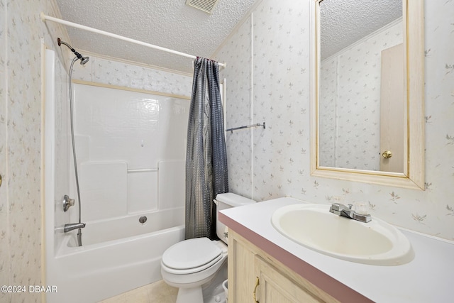 full bathroom featuring shower / tub combo with curtain, vanity, toilet, and a textured ceiling