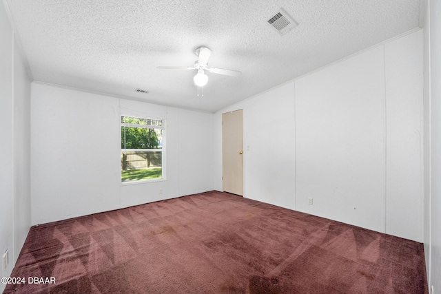 carpeted empty room with a textured ceiling and ceiling fan