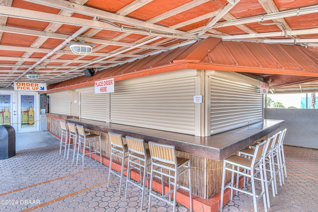 view of patio featuring an outdoor bar