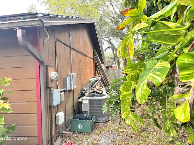 exterior space with fence and central air condition unit