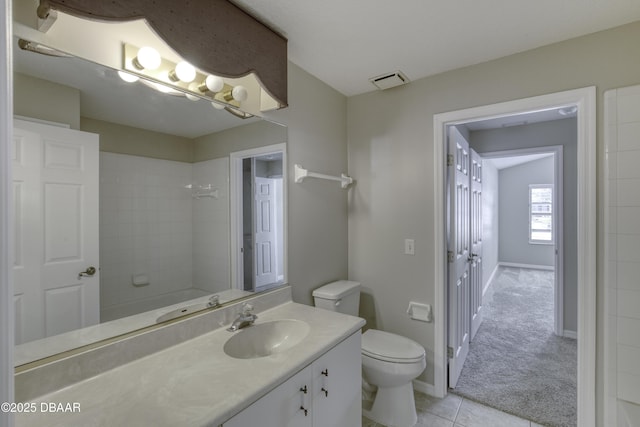 438 Harbour Town Ln, Ormond Beach, FL 32174 - bathroom featuring toilet, vanity, tile patterned flooring, a shower, and baseboards