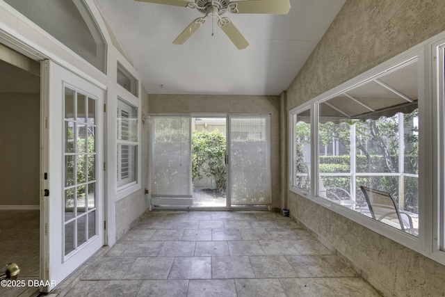 438 Harbour Town Ln, Ormond Beach, FL 32174 - unfurnished sunroom with stone finish floors and lofted ceiling