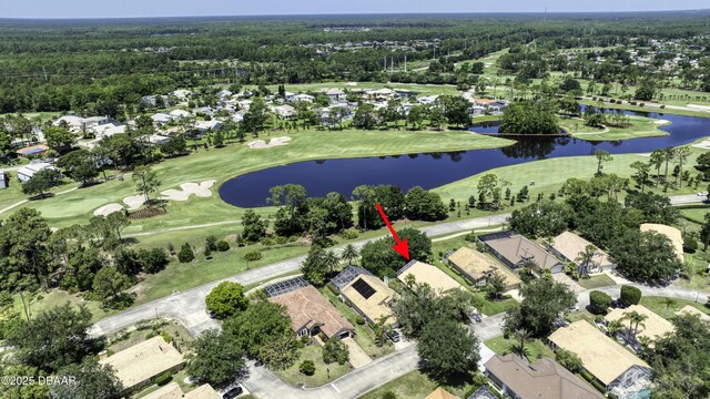 438 Harbour Town Ln, Ormond Beach, FL 32174 - aerial overview of property's location with nearby suburban area, a nearby body of water, a local golf course, and a heavily wooded area