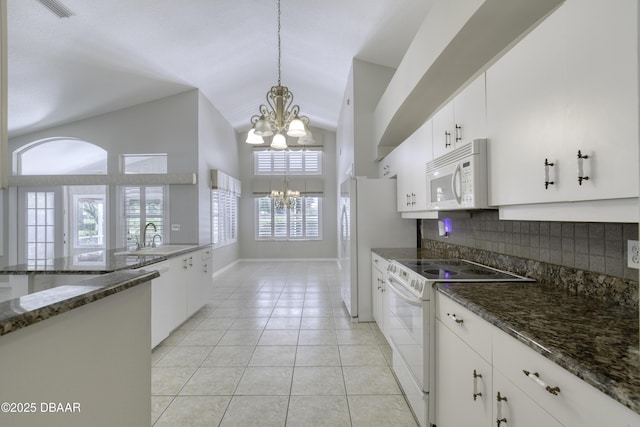 438 Harbour Town Ln, Ormond Beach, FL 32174 - kitchen with white appliances, a chandelier, a sink, tasteful backsplash, and pendant lighting