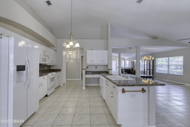 438 Harbour Town Ln, Ormond Beach, FL 32174 - kitchen with white appliances, a chandelier, a sink, light tile patterned flooring, and lofted ceiling
