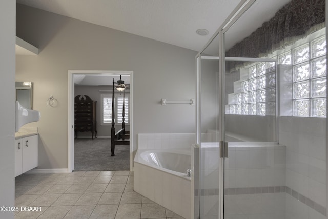 438 Harbour Town Ln, Ormond Beach, FL 32174 - full bathroom with vanity, a bath, tile patterned floors, ceiling fan, and vaulted ceiling