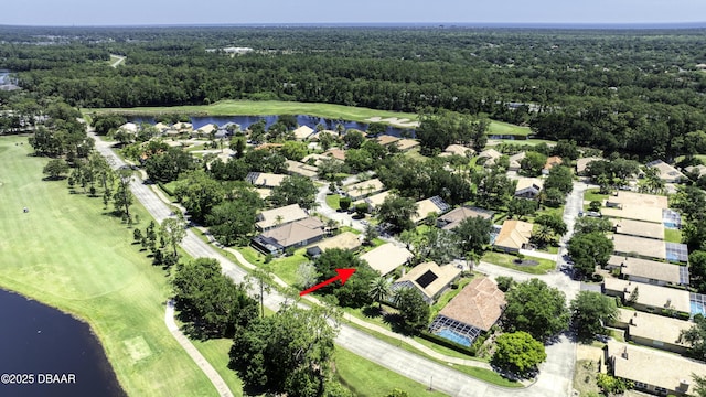 438 Harbour Town Ln, Ormond Beach, FL 32174 - aerial view of residential area featuring a large body of water, a heavily wooded area, and a local golf course