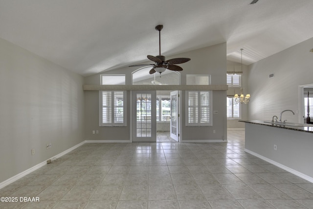 438 Harbour Town Ln, Ormond Beach, FL 32174 - unfurnished living room featuring vaulted ceiling, a ceiling fan, a chandelier, light tile patterned floors, and a sink