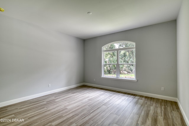 empty room with light hardwood / wood-style floors