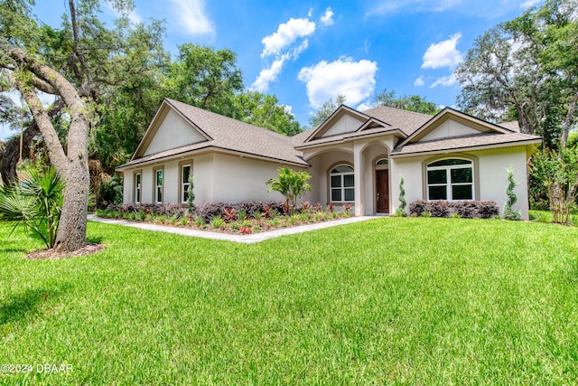 view of front of home with a front yard