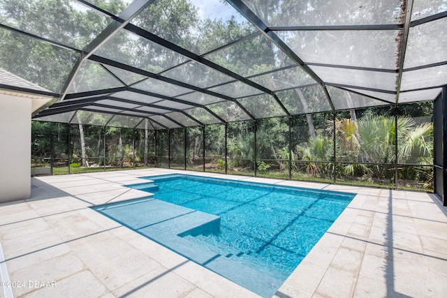 view of pool with a lanai and a patio area