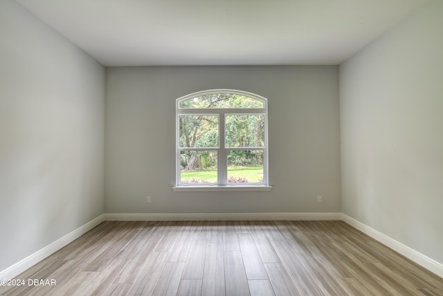 spare room with light hardwood / wood-style flooring