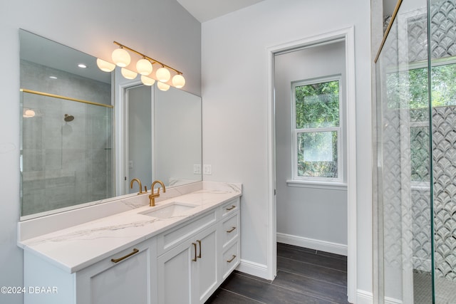 bathroom featuring walk in shower, wood-type flooring, and vanity