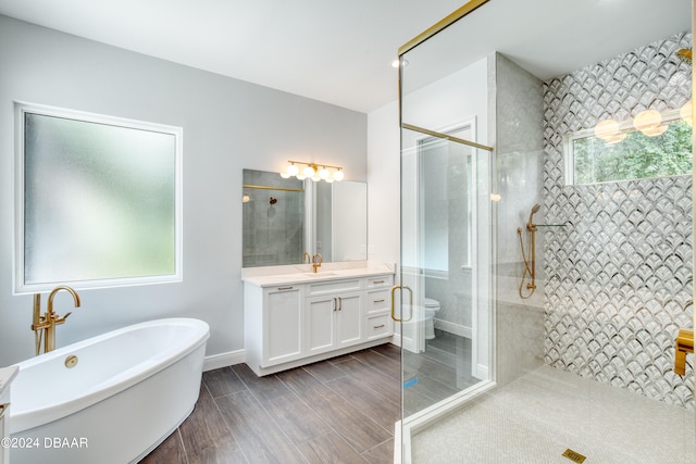 bathroom with independent shower and bath and vanity