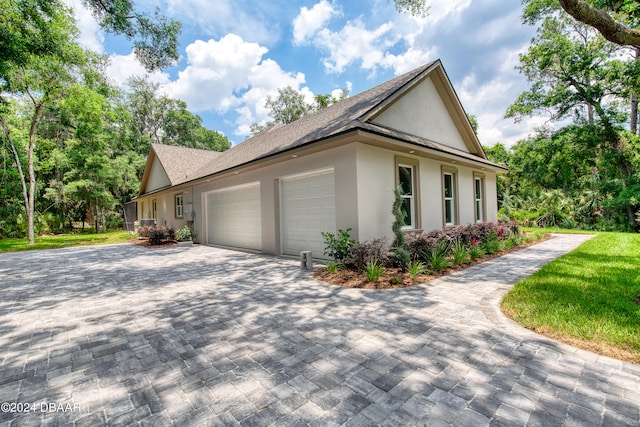 view of side of home with a garage