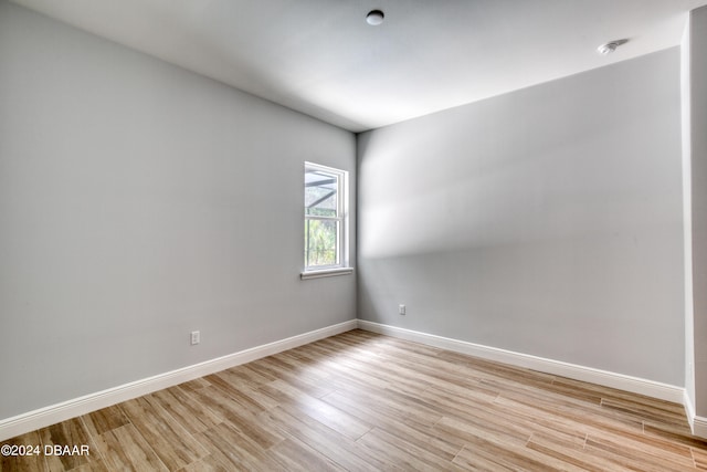 spare room with light wood-type flooring