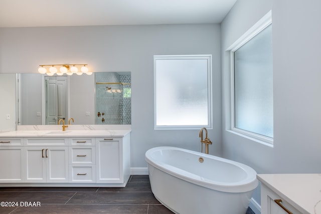 bathroom with independent shower and bath, wood-type flooring, and vanity