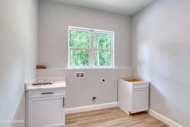 laundry room with washer hookup, electric dryer hookup, and light hardwood / wood-style floors