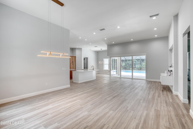 unfurnished living room featuring light hardwood / wood-style flooring