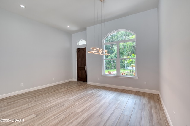 spare room featuring light hardwood / wood-style floors