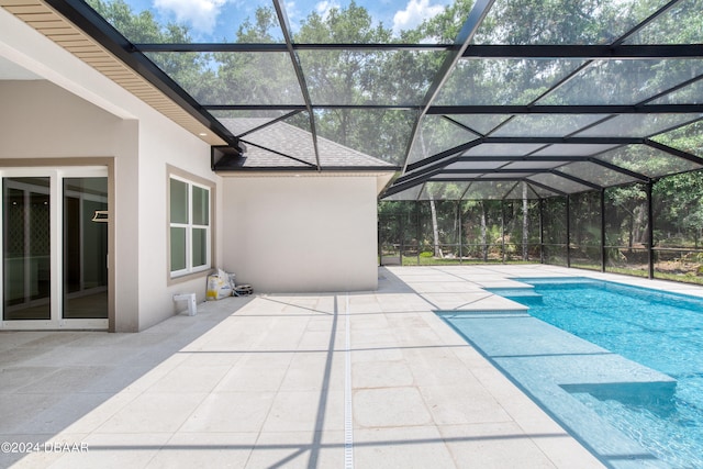 view of pool featuring a patio area and a lanai