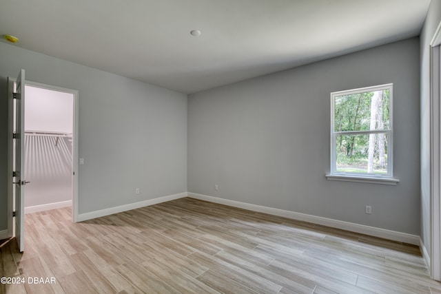 empty room with light hardwood / wood-style floors