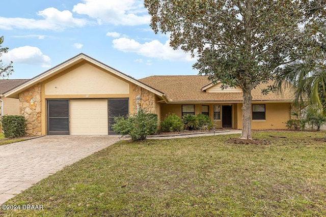 ranch-style house featuring a front lawn and a garage