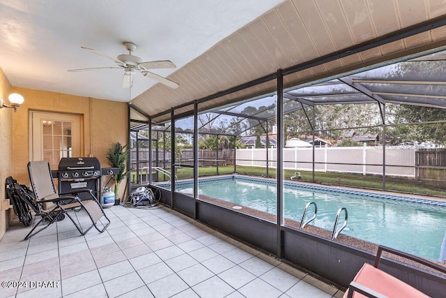 view of swimming pool featuring ceiling fan and area for grilling