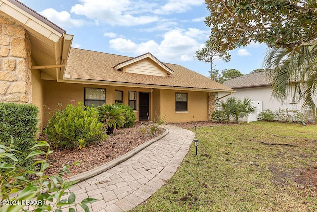 exterior space with a front lawn