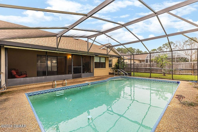 view of swimming pool with a lanai and a sunroom