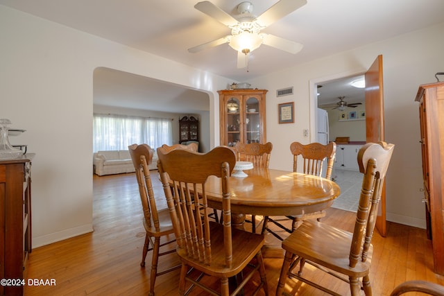 dining area featuring light hardwood / wood-style floors and ceiling fan