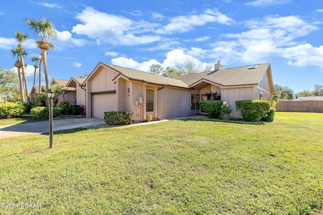 ranch-style home featuring a front yard and a garage