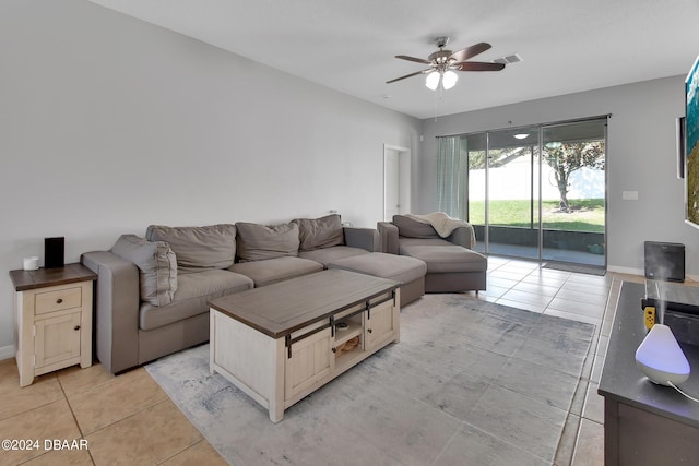 living room featuring ceiling fan and light tile patterned floors