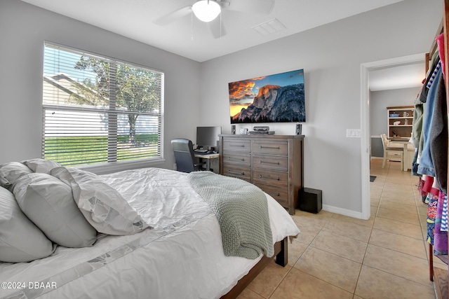 bedroom featuring light tile patterned floors and ceiling fan