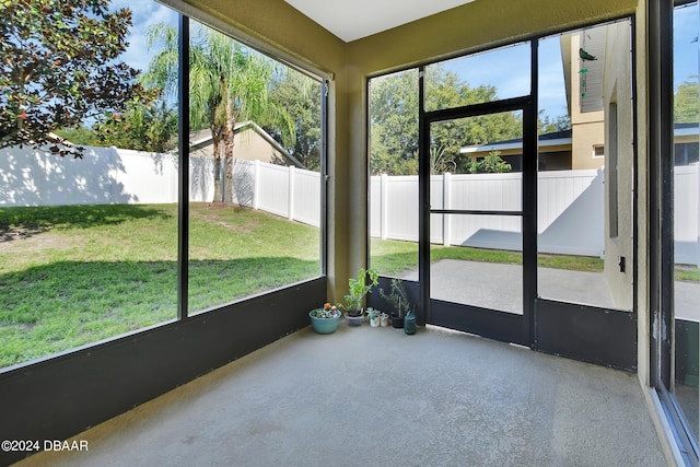 unfurnished sunroom featuring plenty of natural light