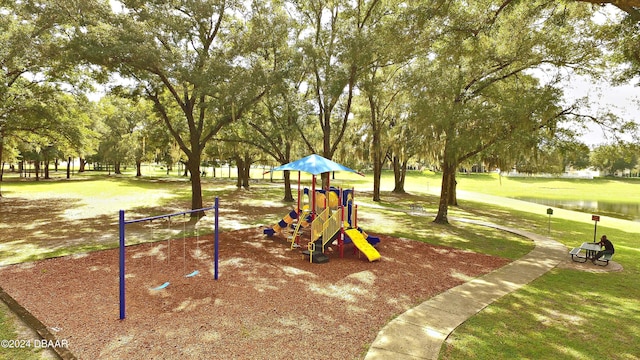 view of jungle gym with a lawn