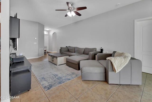 living room with light tile patterned floors and ceiling fan