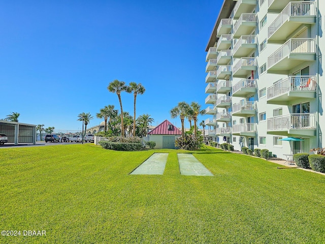 100 Silver Beach Ave Unit 118, Daytona Beach, FL 32118 - view of property's community with a lawn and shuffleboard