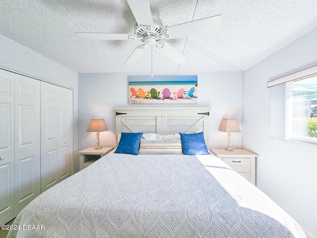 100 Silver Beach Ave Unit 118, Daytona Beach, FL 32118 - bedroom featuring a closet, a textured ceiling, and ceiling fan