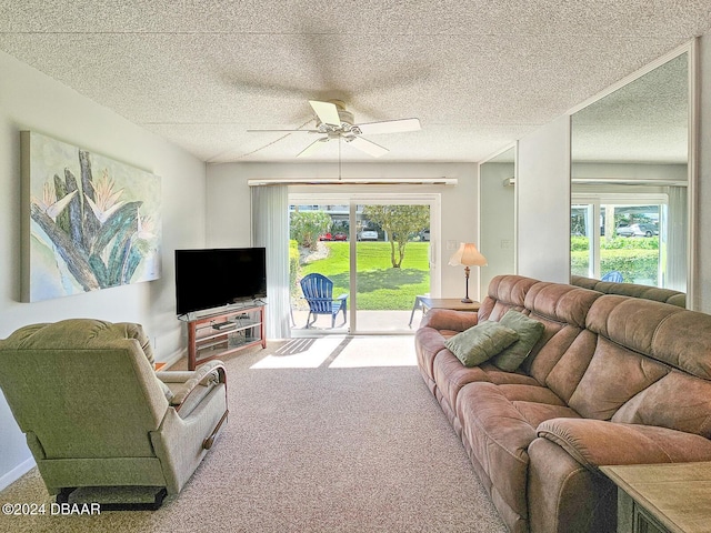 100 Silver Beach Ave Unit 118, Daytona Beach, FL 32118 - carpeted living room with ceiling fan, healthy amount of natural light, and a textured ceiling