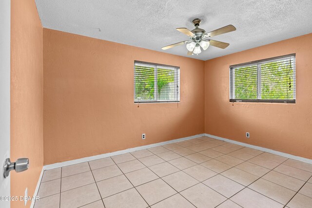 1572 Primrose Ln, Daytona Beach, FL 32117 - spare room featuring healthy amount of natural light, a textured ceiling, ceiling fan, and light tile patterned floors