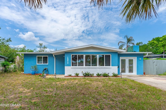 1572 Primrose Ln, Daytona Beach, FL 32117 - single story home featuring stucco siding, french doors, and brick siding
