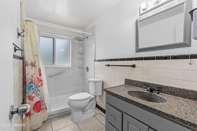 1572 Primrose Ln, Daytona Beach, FL 32117 - bathroom with tile walls, a tile shower, tile patterned flooring, vanity, and toilet