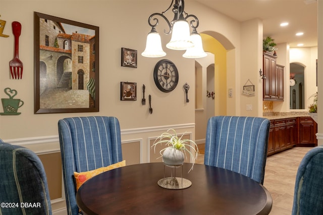 dining room with a chandelier