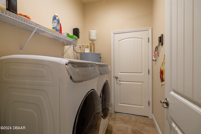 clothes washing area with washer and dryer