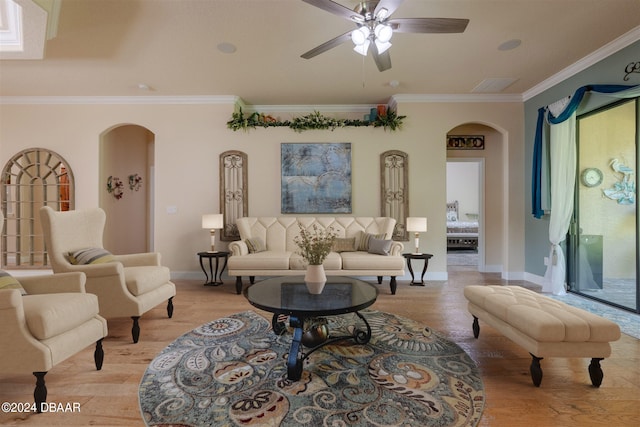 living room featuring ornamental molding, ceiling fan, and light hardwood / wood-style floors